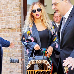 Beyoncé Is Giving Big Buzz Energy in Oversize Sunnies and a Yellow Satin  Set